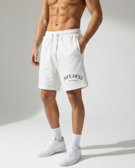 Person wearing white shorts with text on a plain background