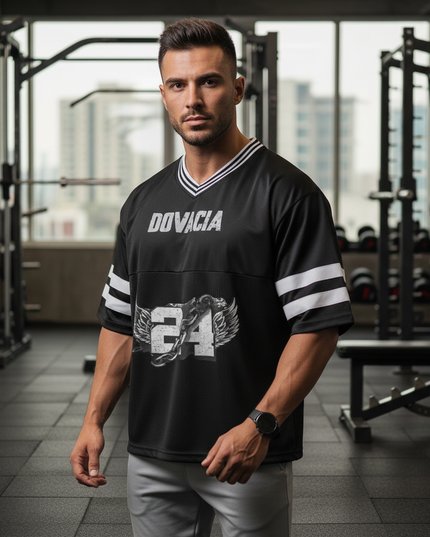Man wearing a black sports jersey with 'Doviacia' branding in a gym setting