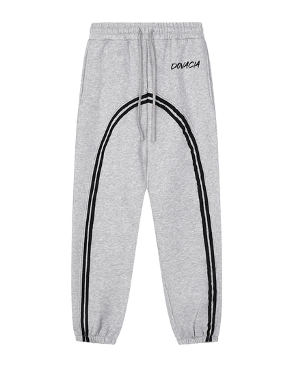 Gray sweatpants with black stripes and 'DOVICH' branding on a white background