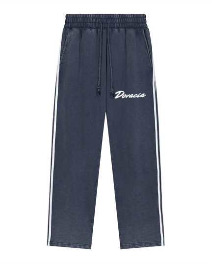 Navy blue pants with white drawstring and 'Doracia' branding on a white background