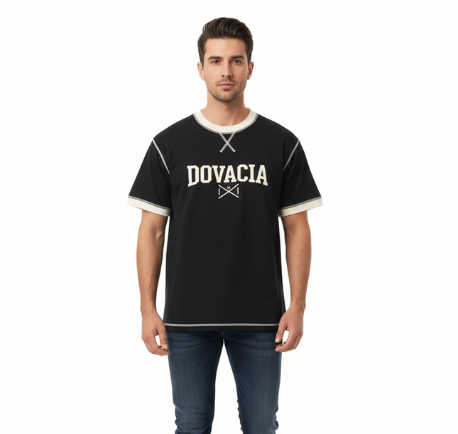 Man wearing a black t-shirt with 'DOVACIA' logo on a white background