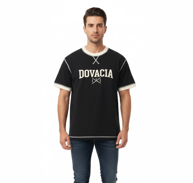 Man wearing a black t-shirt with 'DOVACIA' logo on a white background