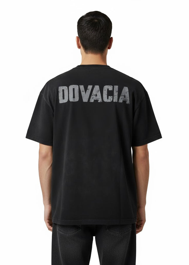 Person wearing a black t-shirt with 'DOVACIA' printed on the back against a white background