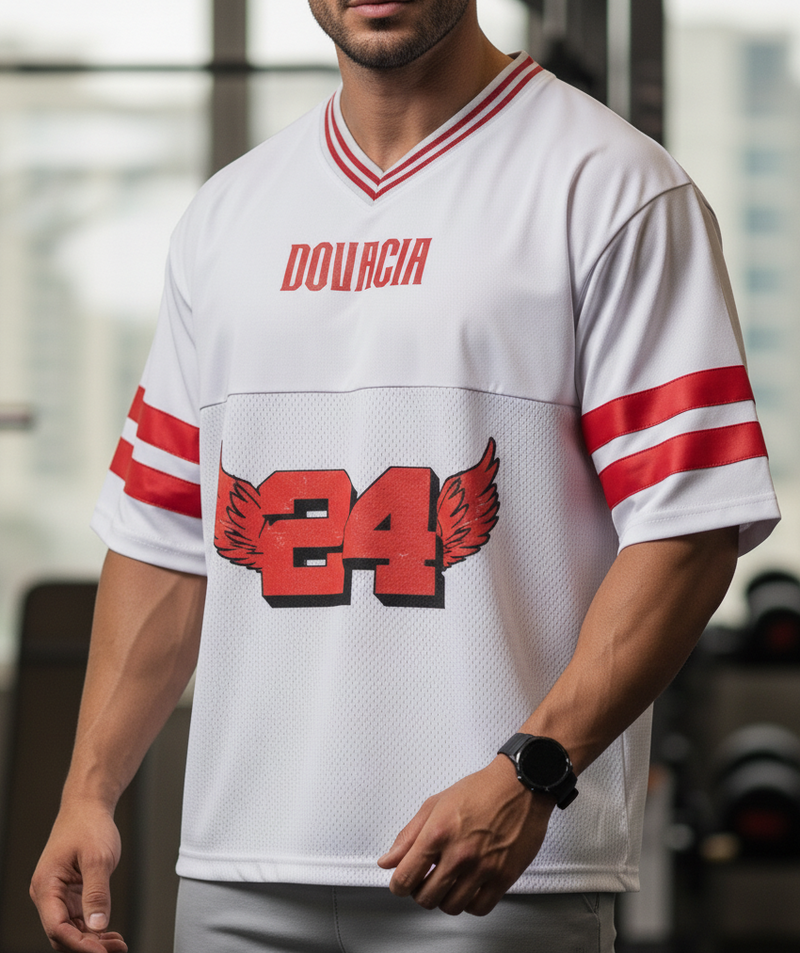 Person wearing a white sports jersey with red accents and 'DOUCIA' branding.