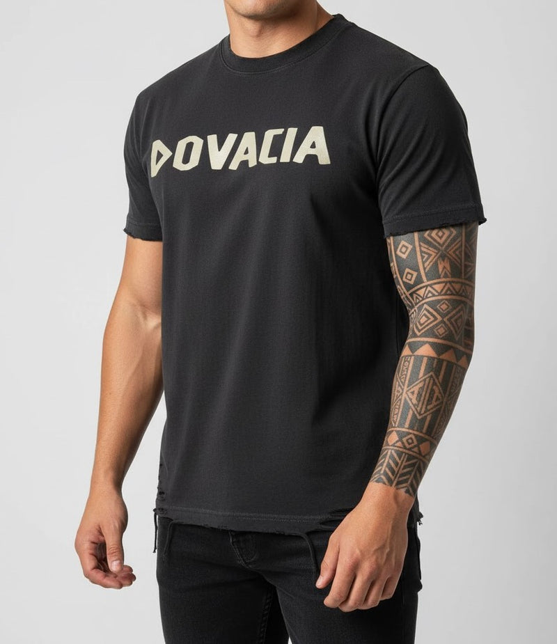 Person wearing a black t-shirt with 'DOVACIA' logo on a gray background